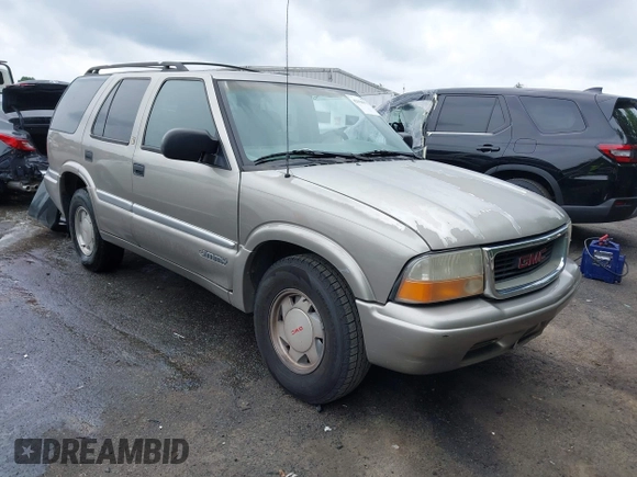1999 GMC Jimmy SLE z VIN 1GKCS13W0X2512048, wystawiony jako IAAI lot #42364175 z przebiegiem 195 301 mil mil oraz . Historia ofert i sprzedaży dostępna na DreamBid. Obrazek 1.