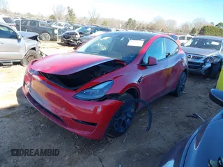 2023 Tesla Model Y Long Range with VIN 7SAYGDEE8PF709459, listed as a IAAI auction lot 41334108 with 51,544 mi miles. Bid and sale history available at carsss.com. Image 2.