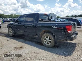 2011 Nissan Titan Pro-4X with VIN 1N6BA0EC6BN313680, listed as a Copart auction lot 60335995 with 241,301 mi miles and Salvage title. Bid and sale history available at DreamBid. Image 2.