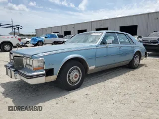 1985 Cadillac Seville z VIN 1G6KS6985FE825187, wystawiony jako Copart lot #54197375 z przebiegiem 2706 mil mil oraz Tytuł czysty. Historia ofert i sprzedaży dostępna na DreamBid. Obrazek 1.
