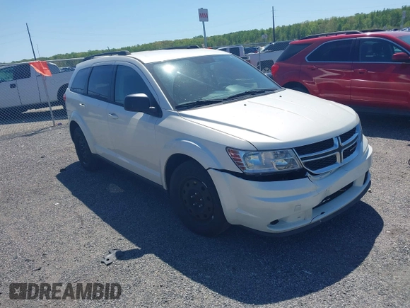 2014 Dodge Journey SE with VIN 3C4PDCAB9ET121415, listed as a IAAI auction lot 42138601 with 157,043 mi miles. Bid and sale history available at carsss.com. Image 1.