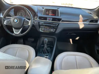 2017 BMW X1 sDrive28i with VIN WBXHU7C39H5H34971, listed as a Copart auction lot 51869265 with 108,051 mi miles and Clean Title. Bid and sale history available at carsss.com. Image 9.