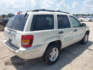 2004 Jeep Grand Cherokee Laredo with VIN 1J4GX48S94C222249, listed as a IAAI auction lot 42598242 with 196,745 mi miles and . Bid and sale history available at DreamBid. Image 4.