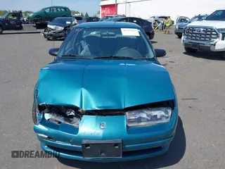 1995 Saturn SL with VIN 1G8ZK5277SZ320711, listed as a IAAI auction lot 42115543 with 77,558 mi miles and . Bid and sale history available at DreamBid. Image 12.