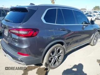 2021 BMW X5 sDrive40i with VIN 5UXCR4C08M9E15642, listed as a IAAI auction lot 41377524 with 76,050 mi miles. Bid and sale history available at carsss.com. Image 4.