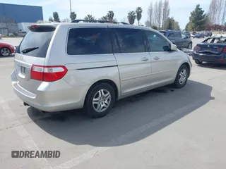 2006 Honda Odyssey EX-L z VIN 5FNRL38736B089963, wystawiony jako IAAI lot #41858061 z przebiegiem 178 845 mil mil oraz . Historia ofert i sprzedaży dostępna na DreamBid. Obrazek 4.