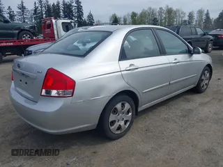 2009 Kia Spectra EX with VIN KNAFE221595659217, listed as a IAAI auction lot 42014406 with 140,527 mi miles. Bid and sale history available at carsss.com. Image 4.