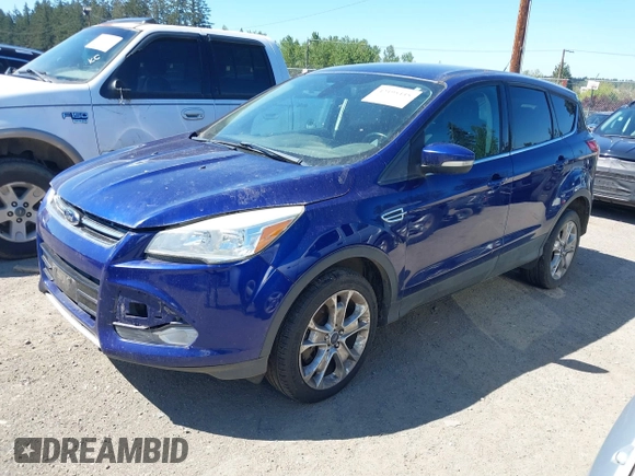 2013 Ford Escape SEL with VIN 1FMCU9HX3DUB97778, listed as a IAAI auction lot 42195445 with 147,154 mi miles. Bid and sale history available at carsss.com. Image 2.