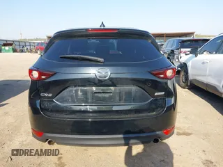 2019 Mazda CX-5 Touring with VIN JM3KFACM6K0533203, listed as a IAAI auction lot 41973125 with 106,882 mi miles and . Bid and sale history available at carsss.com. Image 17.