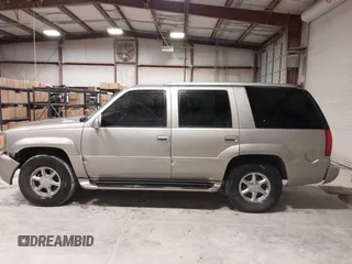 1999 Cadillac Escalade z VIN 1GYEK13RXXR413480, wystawiony jako IAAI lot #41552688 z przebiegiem 214 501 mil mil oraz . Historia ofert i sprzedaży dostępna na DreamBid. Obrazek 14.