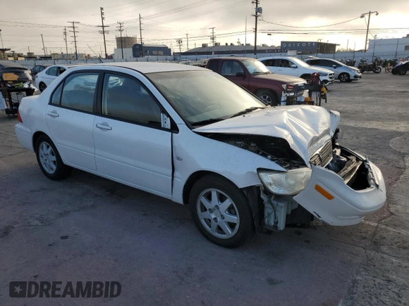2002 Mitsubishi Lancer LS with VIN JA3AJ36E02U064779, listed as a Copart auction lot 86749184 with 127,343 mi miles and Salvage Title. Bid and sale history available at carsss.com. Image 4.