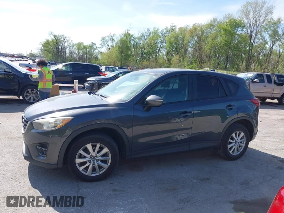 2016 Mazda CX-5 Touring z VIN JM3KE2CY4G0708972, wystawiony jako IAAI lot #42043013 z przebiegiem 157 573 mil mil oraz . Historia ofert i sprzedaży dostępna na DreamBid. Obrazek 14.