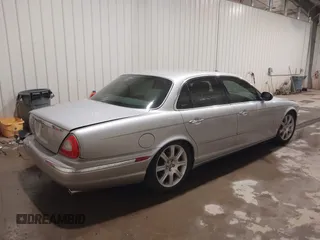 2004 Jaguar XJ with VIN SAJWA71C04SG33993, listed as a IAAI auction lot 41193040 with 79,944 mi miles. Bid and sale history available at carsss.com. Image 4.