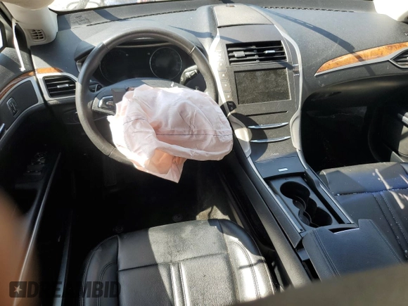 2016 Lincoln MKZ с VIN 3LN6L2G95GR606837, выставлен на аукционе Copart как лот 57356815 с пробегом 67 898 миль миль и Списание • Salvage title. История ставок и продаж доступна на DreamBid. Изображение 8.