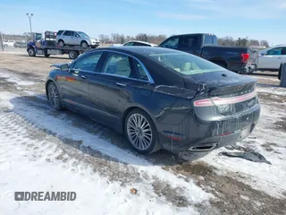 2014 Lincoln MKZ z VIN 3LN6L2GKXER809691, wystawiony jako IAAI lot #41588488 z przebiegiem 163 552 mil mil oraz . Historia ofert i sprzedaży dostępna na DreamBid. Obrazek 3.