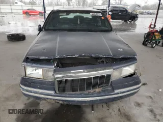 1995 Lincoln Town Car Signature z VIN 1LNLM82W0SY744473, wystawiony jako Copart lot #44752735 z przebiegiem Nie podano mil oraz Szkoda całkowita • Salvage title. Historia ofert i sprzedaży dostępna na DreamBid. Obrazek 5.