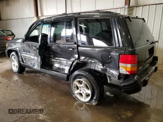 1998 Jeep Grand Cherokee Limited z VIN 1J4GZ88Z0WC276394, wystawiony jako Copart lot #46702355 z przebiegiem 144 232 mil mil oraz Szkoda całkowita • Salvage title. Historia ofert i sprzedaży dostępna na DreamBid. Obrazek 2.