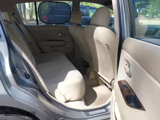 2010 Nissan Versa 1.8 SL with VIN 3N1BC1CP5AL357518, listed as a IAAI auction lot 42090152 with 149,821 mi miles. Bid and sale history available at carsss.com. Image 8.