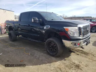 2017 Nissan Titan XD SV with VIN 1N6BA1F49HN556566, listed as a Copart auction lot 85102544 with 157,065 mi miles and Clean Title. Bid and sale history available at carsss.com. Image 4.
