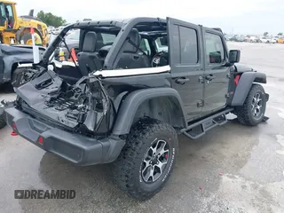 2021 Jeep Wrangler Unlimited Rubicon with VIN 1C4HJXFG7MW662092, listed as a IAAI auction lot 42139521 with 32,055 mi miles and . Bid and sale history available at carsss.com. Image 4.