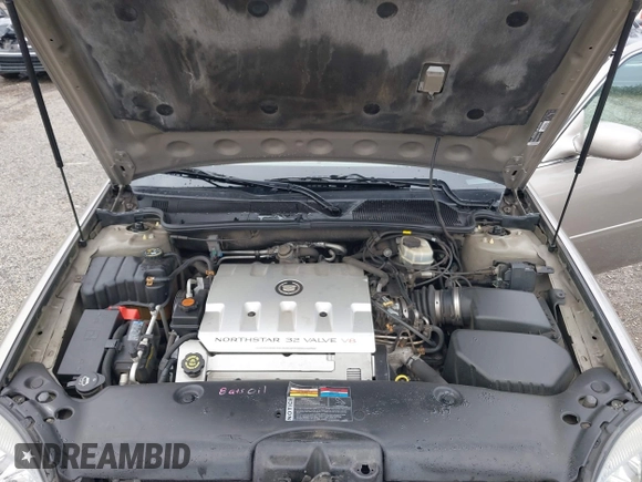 2002 Cadillac DeVille z VIN 1G6KD54Y32U108623, wystawiony jako IAAI lot #41957171 z przebiegiem 136 941 mil mil oraz . Historia ofert i sprzedaży dostępna na DreamBid. Obrazek 10.