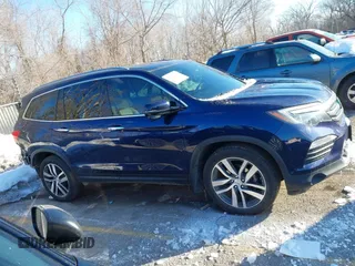 2017 Honda Pilot Touring with VIN 5FNYF6H99HB105446, listed as a IAAI auction lot 41283368 with 91,452 mi miles and . Bid and sale history available at DreamBid. Image 14.