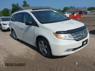 2012 Honda Odyssey Touring с VIN 5FNRL5H92CB022151, выставлен на аукционе IAAI как лот 42483340 с пробегом 184 262 миль миль и . История ставок и продаж доступна на DreamBid. Изображение 1.