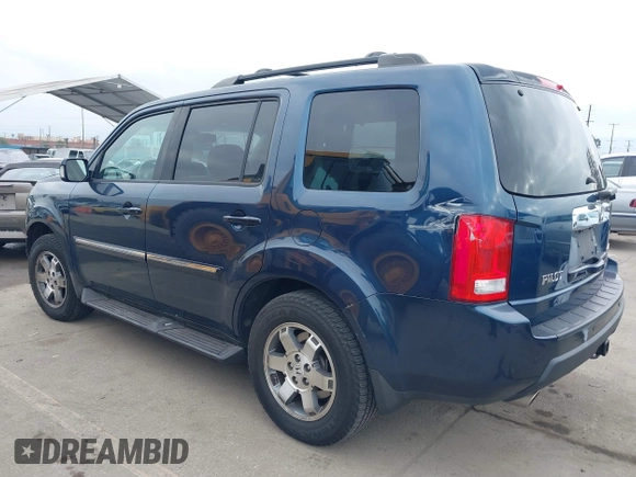2009 Honda Pilot Touring with VIN 5FNYF48929B040199, listed as a IAAI auction lot 41466006 with 167,959 mi miles and . Bid and sale history available at carsss.com. Image 3.