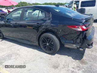 2025 Toyota Camry LE z VIN 4T1DAACK0SU024677, wystawiony jako IAAI lot #42468532 z przebiegiem 21 937 mil mil oraz . Historia ofert i sprzedaży dostępna na DreamBid. Obrazek 6.
