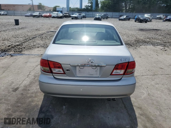 2003 Infiniti I35 Luxury z VIN JNKDA31AX3T114189, wystawiony jako Copart lot #64702444 z przebiegiem 93 542 mil mil oraz Tytuł czysty. Historia ofert i sprzedaży dostępna na DreamBid. Obrazek 6.