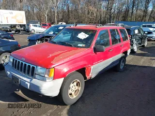 1997 Jeep Grand Cherokee Laredo with VIN 1J4GZ58S0VC550242, listed as a IAAI auction lot 41032114 with 185,307 mi miles. Bid and sale history available at carsss.com. Image 2.