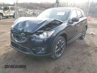 2016 Mazda CX-5 Grand Touring with VIN JM3KE4DY1G0823989, listed as a IAAI auction lot 41770149 with 40,677 mi miles. Bid and sale history available at carsss.com. Image 17.