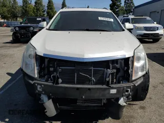 2015 Cadillac SRX Luxury Collection z VIN 3GYFNBE31FS634519, wystawiony jako Copart lot #57292645 z przebiegiem 93 777 mil mil oraz Szkody całkowita. Historia ofert i sprzedaży dostępna na DreamBid. Obrazek 5.