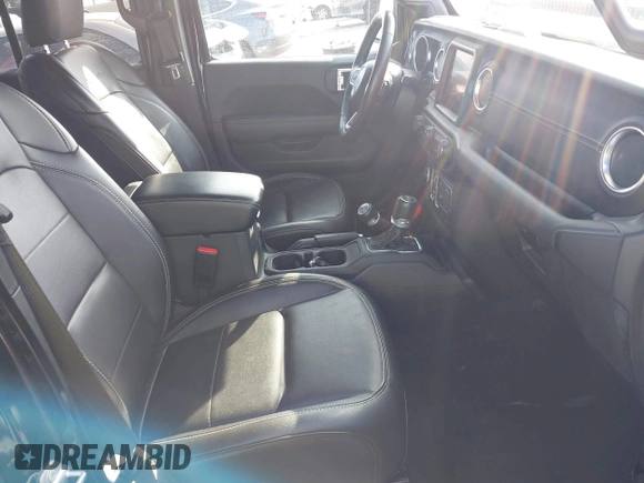 2023 Jeep Wrangler Sahara with VIN 1C4JJXP67PW556933, listed as a IAAI auction lot 41587035 with 20,463 mi miles and . Bid and sale history available at DreamBid. Image 5.