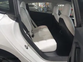 2023 Tesla Model 3 Performance with VIN 5YJ3E1EC3PF404882, listed as a IAAI auction lot 41551557 with 36,698 mi miles. Bid and sale history available at carsss.com. Image 7.