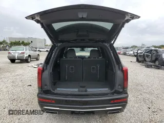 2024 Cadillac XT6 FWD Luxury z VIN 1GYKPAR41RZ734536, wystawiony jako Copart lot #46669655 z przebiegiem 11 916 mil mil oraz Szkoda całkowita • Salvage title. Historia ofert i sprzedaży dostępna na DreamBid. Obrazek 6.