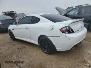 2008 Hyundai Tiburon GS z VIN KMHHM66DX8U290154, wystawiony jako Copart lot #67054434 z przebiegiem 191 963 mil mil oraz Nie do naprawy • Non repairable. Historia ofert i sprzedaży dostępna na DreamBid. Obrazek 2.