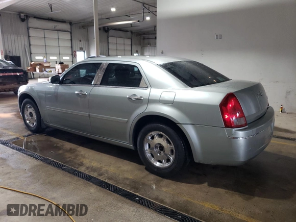 2005 Chrysler 300 with VIN 2C3JA53G65H556313, listed as a Copart auction lot 51839305 with 124,358 mi miles and Salvage Title. Bid and sale history available at carsss.com. Image 2.