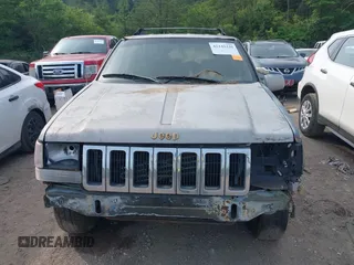 1994 Jeep Grand Cherokee Laredo z VIN 1J4GZ58Y1RC265589, wystawiony jako IAAI lot #42142226 z przebiegiem 138 656 mil mil oraz . Historia ofert i sprzedaży dostępna na DreamBid. Obrazek 6.