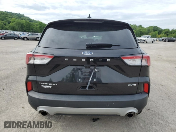 2021 Ford Escape Titanium with VIN 1FMCU9J97MUA57521, listed as a Copart auction lot 58714055 with 83,201 mi miles and Salvage title. Bid and sale history available at DreamBid. Image 6.