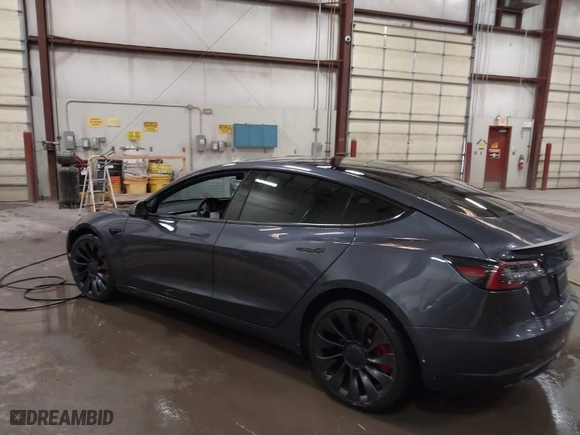 2021 Tesla Model 3 Performance with VIN 5YJ3E1EC3MF044802, listed as a IAAI auction lot 41891096 with 56,001 mi miles. Bid and sale history available at carsss.com. Image 3.