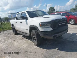 2021 Ram 1500 Rebel with VIN 1C6SRFLT4MN514876, listed as a IAAI auction lot 40466708 with 51,621 mi miles and . Bid and sale history available at DreamBid. Image 1.