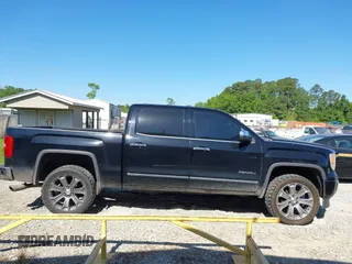 2015 GMC Sierra 1500 Denali with VIN 3GTU2WEJ6FG400004, listed as a IAAI auction lot 42097356 with 148,544 mi miles and . Bid and sale history available at DreamBid. Image 13.
