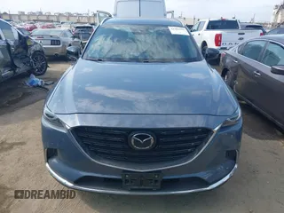 2021 Mazda CX-9 Carbon Edition z VIN JM3TCBDY0M0526352, wystawiony jako IAAI lot #42403901 z przebiegiem 50 193 mil mil oraz . Historia ofert i sprzedaży dostępna na DreamBid. Obrazek 12.