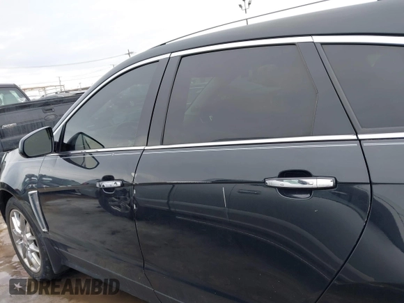 2013 Cadillac SRX Performance Collection with VIN 3GYFNHE33DS527519, listed as a IAAI auction lot 41652822 with 201,580 mi miles. Bid and sale history available at carsss.com. Image 14.