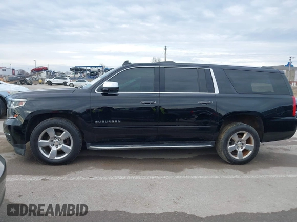 2019 Chevrolet Suburban Premier with VIN 1GNSKJKC7KR261826, listed as a IAAI auction lot 41652451 with 127,032 mi miles and . Bid and sale history available at DreamBid. Image 14.