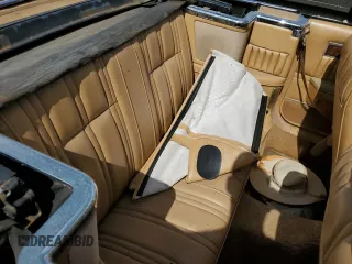 1986 Chrysler LeBaron z VIN 1C3BC55D0GG153072, wystawiony jako Copart lot #77865854 z przebiegiem 74 922 mil mil oraz Szkoda całkowita • Salvage title. Historia ofert i sprzedaży dostępna na DreamBid. Obrazek 10.