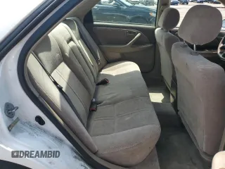 1998 Toyota Camry LE z VIN JT2BG22K4W0197464, wystawiony jako Copart lot #54768195 z przebiegiem Nie podano mil oraz Czysty tytuł • Clean title. Historia ofert i sprzedaży dostępna na DreamBid. Obrazek 10.