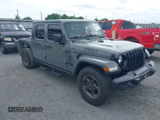 2021 Jeep Gladiator Sport S z VIN 1C6HJTAG5ML570892, wystawiony jako IAAI lot #42125056 z przebiegiem 83 623 mil mil oraz . Historia ofert i sprzedaży dostępna na DreamBid. Obrazek 1.