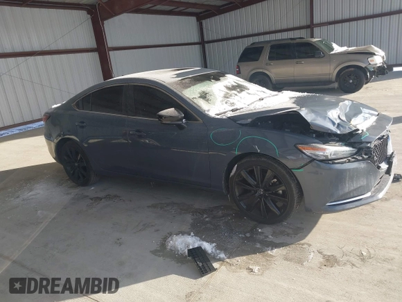 2021 Mazda 6 Carbon Edition with VIN JM1GL1WY6M1616617, listed as a IAAI auction lot 41365615 with 60,747 mi miles and . Bid and sale history available at DreamBid. Image 13.